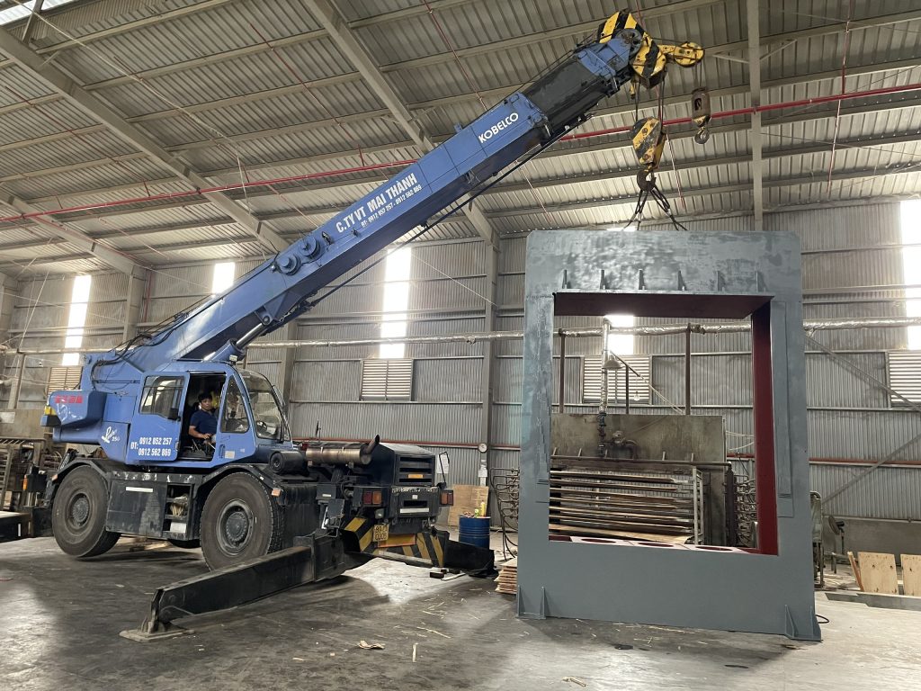 Hot press machine is being installed.